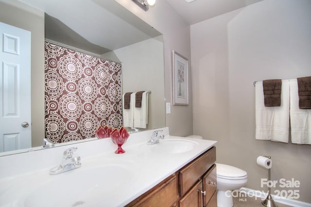 9792 Ravenscroft Ln NW, Concord, NC 28027 - bathroom featuring toilet and double vanity