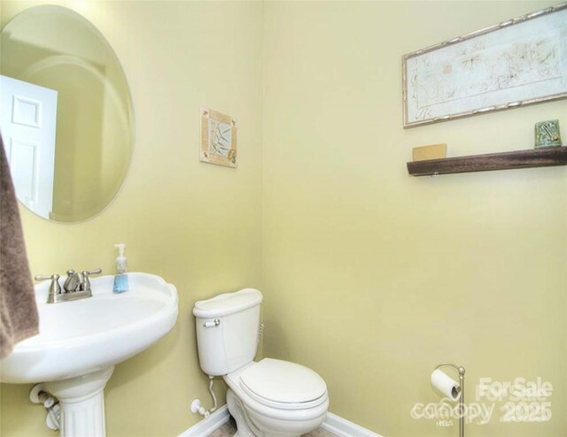 9792 Ravenscroft Ln NW, Concord, NC 28027 - bathroom with baseboards and toilet