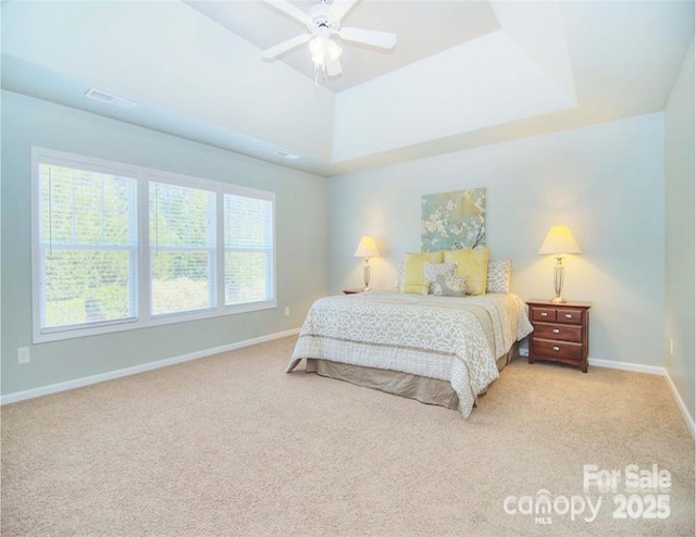 9792 Ravenscroft Ln NW, Concord, NC 28027 - bedroom with light carpet, a raised ceiling, and a ceiling fan