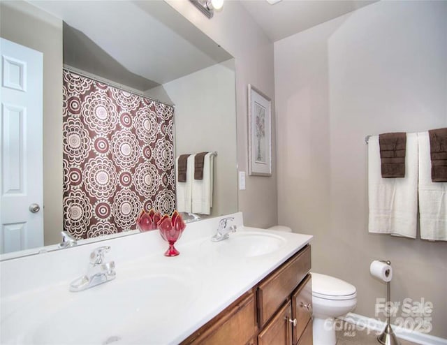 9792 Ravenscroft Ln NW, Concord, NC 28027 - bathroom featuring toilet and double vanity