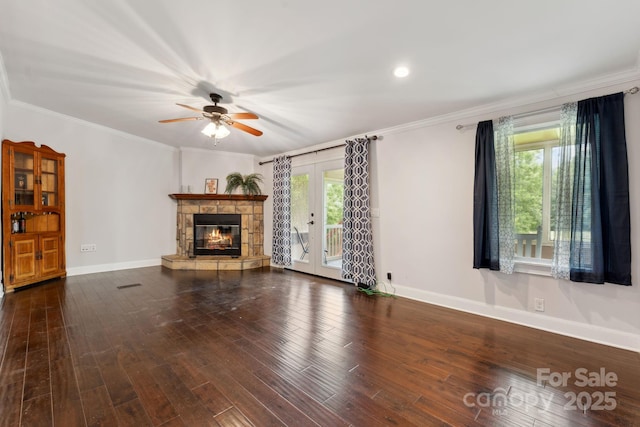 152 Lantana Dr, Sylva, NC 28779 - unfurnished living room featuring a ceiling fan, ornamental molding, a stone fireplace, and wood finished floors