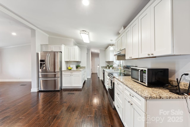 152 Lantana Dr, Sylva, NC 28779 - kitchen with stainless steel appliances, under cabinet range hood, ornamental molding, white cabinets, and dark wood-style flooring