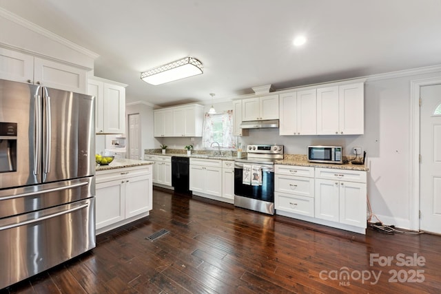 152 Lantana Dr, Sylva, NC 28779 - kitchen with appliances with stainless steel finishes, crown molding, white cabinets, under cabinet range hood, and light stone countertops