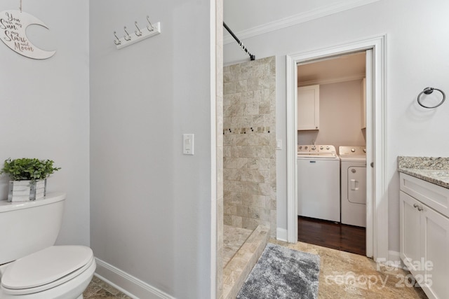 152 Lantana Dr, Sylva, NC 28779 - bathroom with independent washer and dryer, ornamental molding, vanity, and a tile shower