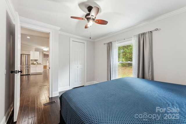 152 Lantana Dr, Sylva, NC 28779 - bedroom featuring stainless steel refrigerator, dark wood-style floors, crown molding, a ceiling fan, and a closet