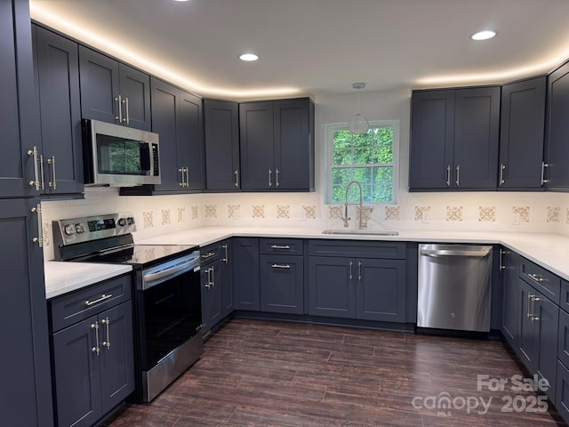 191 Harmony Grove Rd, Nebo, NC 28761 - kitchen with stainless steel appliances, light countertops, tasteful backsplash, recessed lighting, and dark wood finished floors