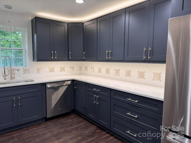 191 Harmony Grove Rd, Nebo, NC 28761 - kitchen featuring appliances with stainless steel finishes, decorative backsplash, dark wood-style flooring, light countertops, and recessed lighting