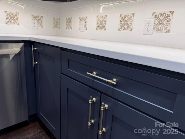 191 Harmony Grove Rd, Nebo, NC 28761 - detailed view of blue cabinetry, backsplash, dark wood finished floors, and light countertops
