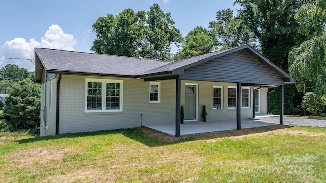 191 Harmony Grove Rd, Nebo, NC 28761 - view of front of property featuring brick siding, a patio, a front lawn, and roof with shingles