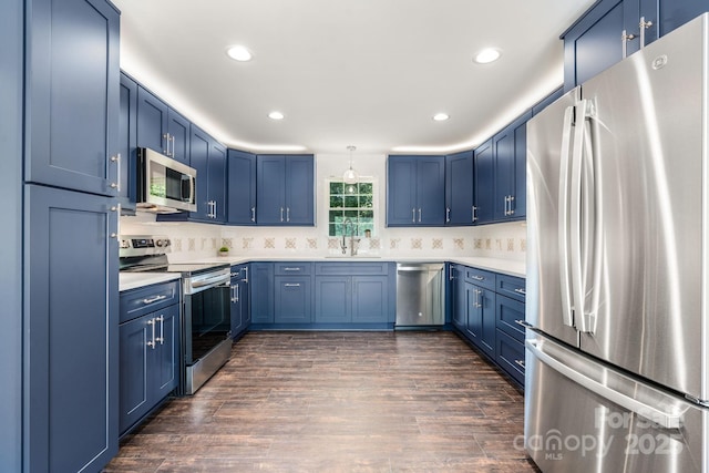 191 Harmony Grove Rd, Nebo, NC 28761 - kitchen featuring appliances with stainless steel finishes, blue cabinets, light countertops, recessed lighting, and dark wood-style flooring
