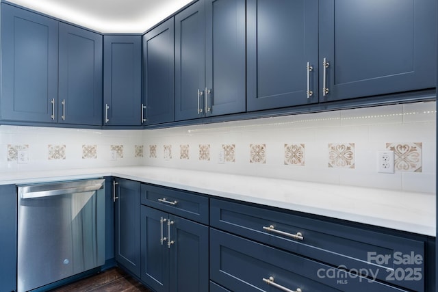 191 Harmony Grove Rd, Nebo, NC 28761 - kitchen with dishwasher, blue cabinets, light countertops, and decorative backsplash
