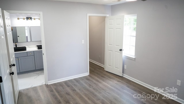 830 Mcarthur Ave, Charlotte, NC 28206 - unfurnished bedroom with wood finished floors and ensuite bathroom