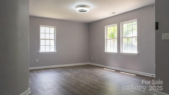 830 Mcarthur Ave, Charlotte, NC 28206 - spare room featuring plenty of natural light and dark wood-style floors