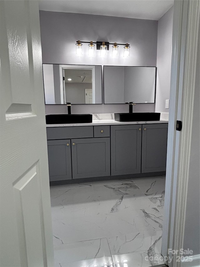 830 Mcarthur Ave, Charlotte, NC 28206 - bathroom with marble look tile flooring and double vanity