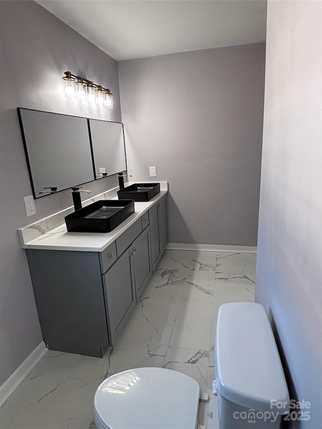 830 Mcarthur Ave, Charlotte, NC 28206 - bathroom featuring marble finish flooring and vanity