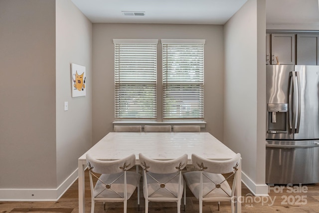 2969 Simpson Dr, Charlotte, NC 28205 - dining space featuring baseboards and light wood-style floors