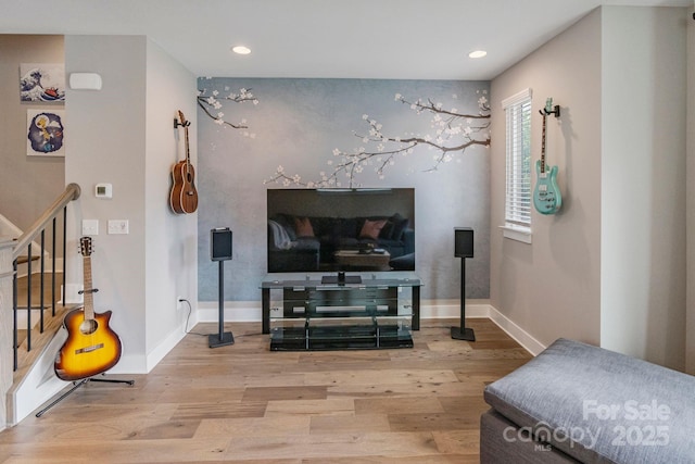 2969 Simpson Dr, Charlotte, NC 28205 - living area featuring wood finished floors, recessed lighting, and stairs