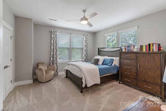 2969 Simpson Dr, Charlotte, NC 28205 - bedroom featuring multiple windows, light carpet, and ceiling fan