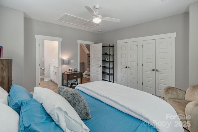 2969 Simpson Dr, Charlotte, NC 28205 - bedroom featuring multiple closets, a ceiling fan, and wood finished floors