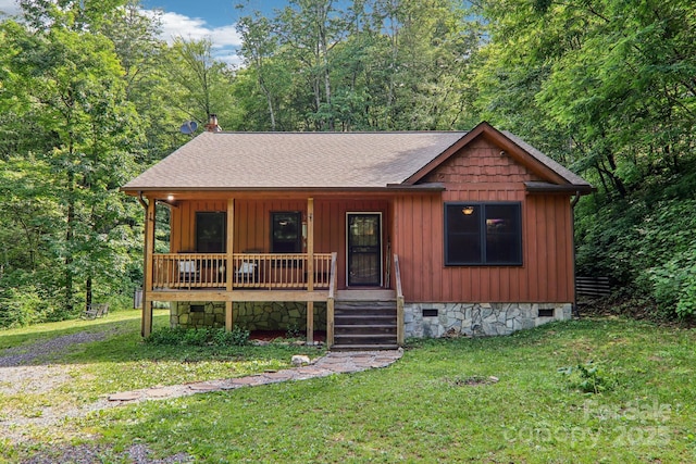 2171 Black Rock Rd, Cherokee, NC 28719 - rustic home featuring covered porch, crawl space, a shingled roof, and a front lawn