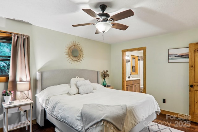 2171 Black Rock Rd, Cherokee, NC 28719 - bedroom with dark wood-type flooring, ensuite bathroom, and a ceiling fan