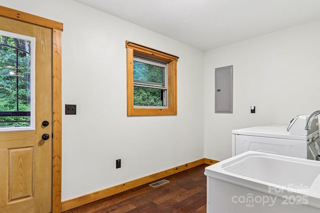 2171 Black Rock Rd, Cherokee, NC 28719 - laundry room featuring electric panel, plenty of natural light, dark wood-style flooring, and independent washer and dryer