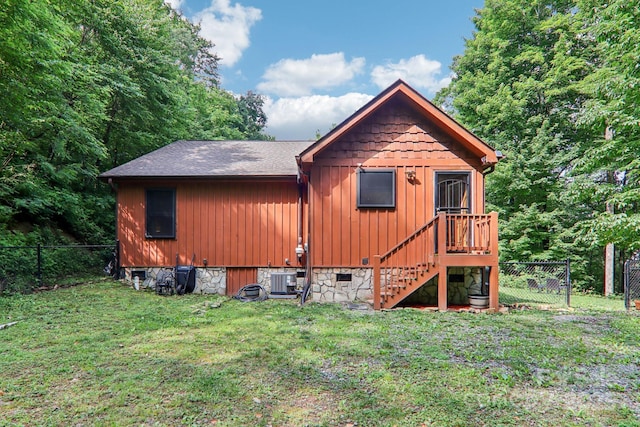2171 Black Rock Rd, Cherokee, NC 28719 - view of front facade with a fenced backyard, board and batten siding, a shingled roof, and stairs