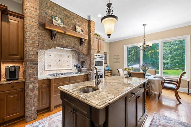 168 Blue Ridge Trl, Mooresville, NC 28117 - kitchen with light wood-style flooring, backsplash, ornamental molding, a chandelier, and double wall oven