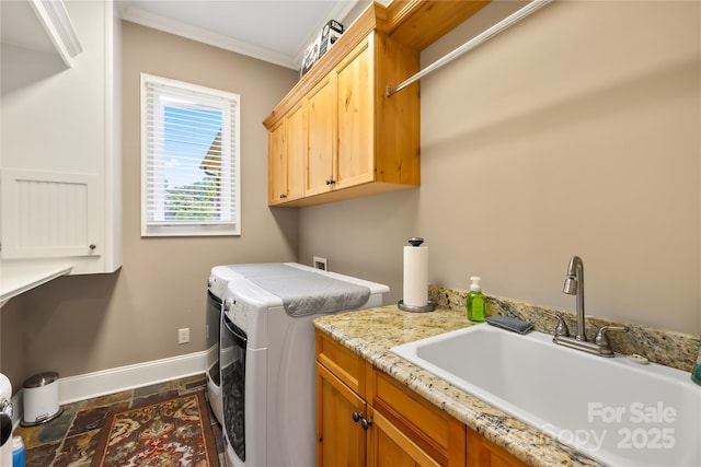168 Blue Ridge Trl, Mooresville, NC 28117 - washroom featuring washer and clothes dryer, cabinet space, ornamental molding, and dark stone finish floors