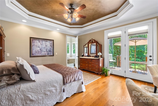 168 Blue Ridge Trl, Mooresville, NC 28117 - bedroom featuring a tray ceiling, access to exterior, light wood-style flooring, multiple windows, and crown molding