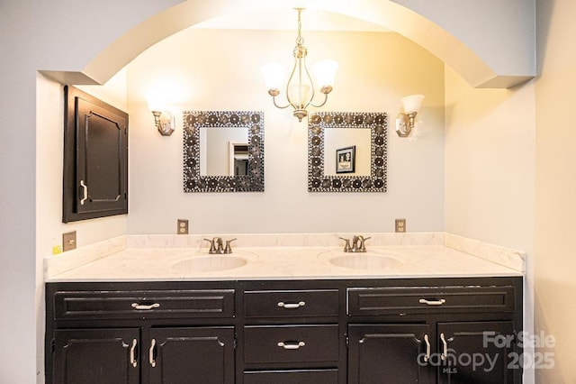 4275 Herman Sipe Rd, Conover, NC 28613 - bathroom featuring double vanity and a chandelier