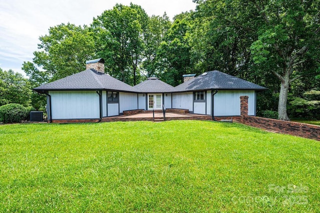 4275 Herman Sipe Rd, Conover, NC 28613 - back of house featuring a lawn and a chimney