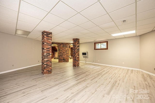 4275 Herman Sipe Rd, Conover, NC 28613 - basement featuring wood finished floors, a paneled ceiling, and heating unit