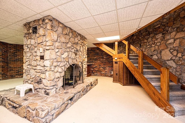 4275 Herman Sipe Rd, Conover, NC 28613 - unfurnished living room featuring a paneled ceiling, stairs, carpet flooring, and a large fireplace