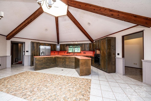4275 Herman Sipe Rd, Conover, NC 28613 - kitchen with black oven, stainless steel fridge with ice dispenser, light tile patterned floors, a center island, and dark brown cabinets