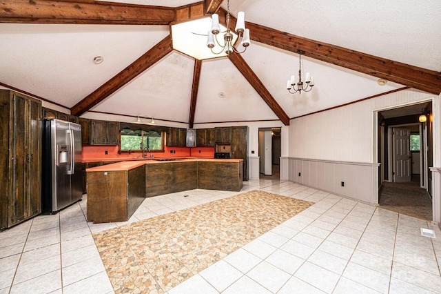 4275 Herman Sipe Rd, Conover, NC 28613 - kitchen featuring stainless steel fridge with ice dispenser, a chandelier, a kitchen island, light countertops, and dark brown cabinets