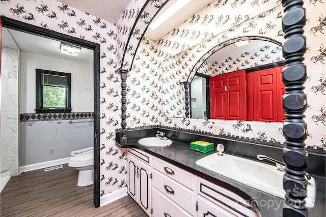 4275 Herman Sipe Rd, Conover, NC 28613 - bathroom with wallpapered walls, wood finished floors, and double vanity