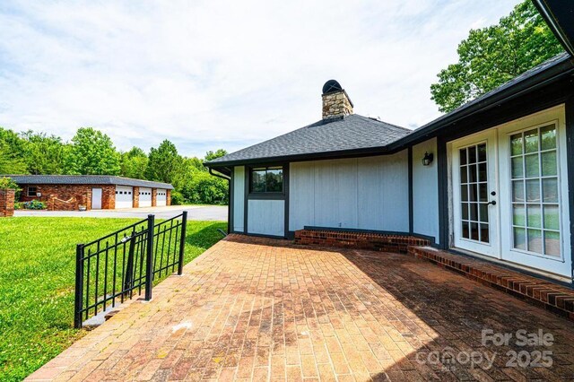 4275 Herman Sipe Rd, Conover, NC 28613 - view of patio / terrace with french doors and a garage