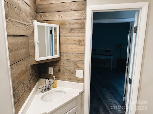 5017 Celeste Ct, Charlotte, NC 27609 - bathroom featuring wood walls, vanity, and wood finished floors