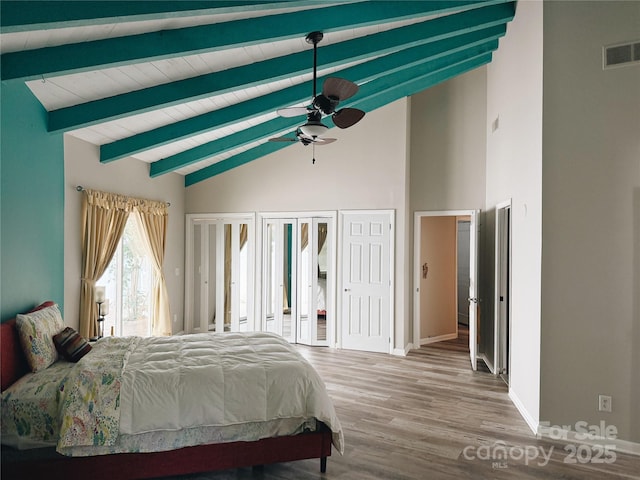 5017 Celeste Ct, Charlotte, NC 27609 - bedroom featuring beamed ceiling, wood finished floors, high vaulted ceiling, and ceiling fan