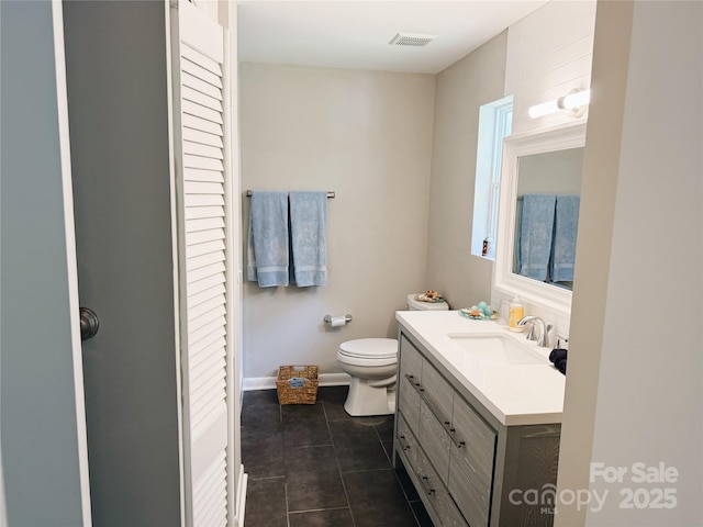 5017 Celeste Ct, Charlotte, NC 27609 - bathroom featuring vanity, tile patterned flooring, and a closet