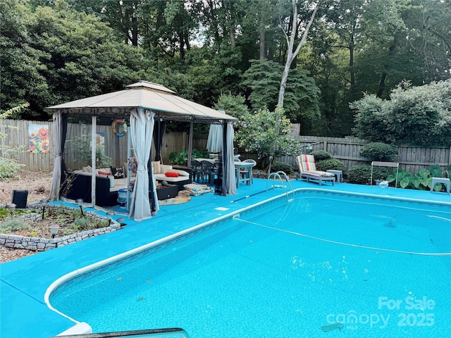 5017 Celeste Ct, Charlotte, NC 27609 - view of swimming pool with a gazebo, a fenced backyard, and a patio