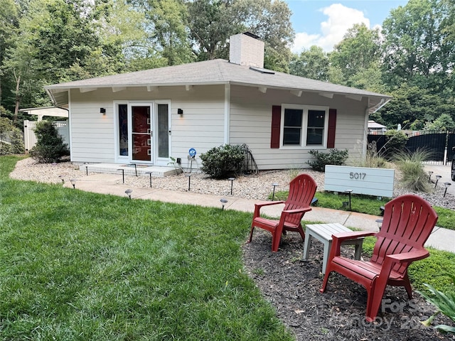 5017 Celeste Ct, Charlotte, NC 27609 - rear view of house with a chimney and roof with shingles
