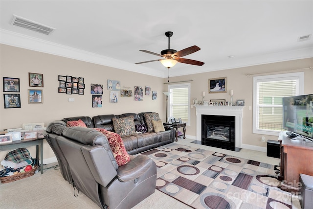 1636 Ridge Haven Rd, Waxhaw, NC 28173 - living room featuring ceiling fan, ornamental molding, and a fireplace with flush hearth