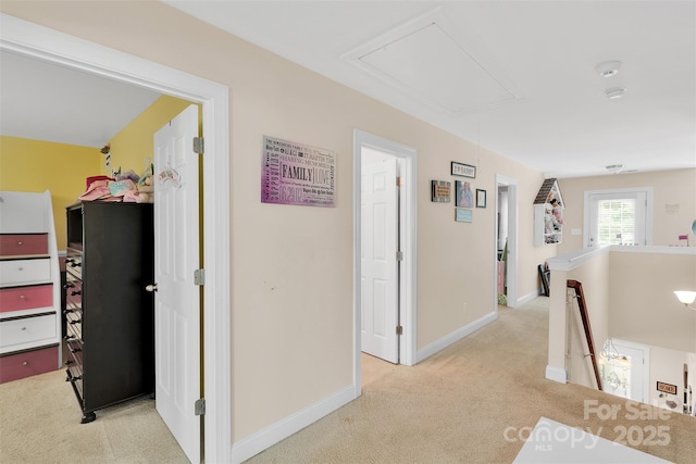 1636 Ridge Haven Rd, Waxhaw, NC 28173 - corridor featuring attic access, light carpet, and an upstairs landing