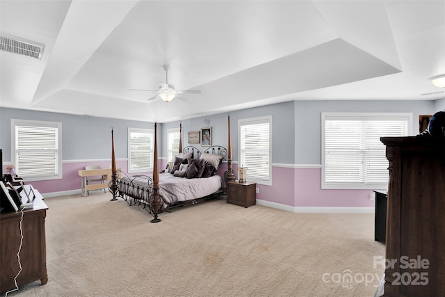 1636 Ridge Haven Rd, Waxhaw, NC 28173 - bedroom with a tray ceiling, carpet floors, and a ceiling fan