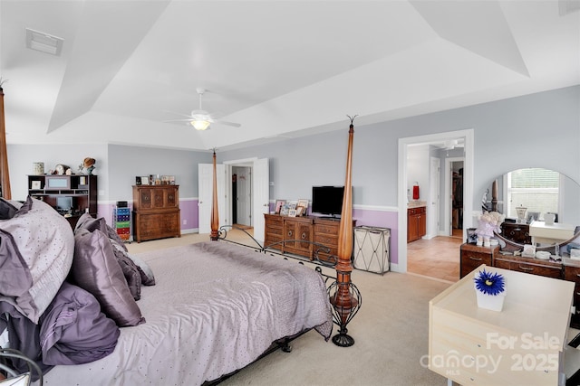 1636 Ridge Haven Rd, Waxhaw, NC 28173 - bedroom with a raised ceiling, light colored carpet, ensuite bathroom, ceiling fan, and arched walkways