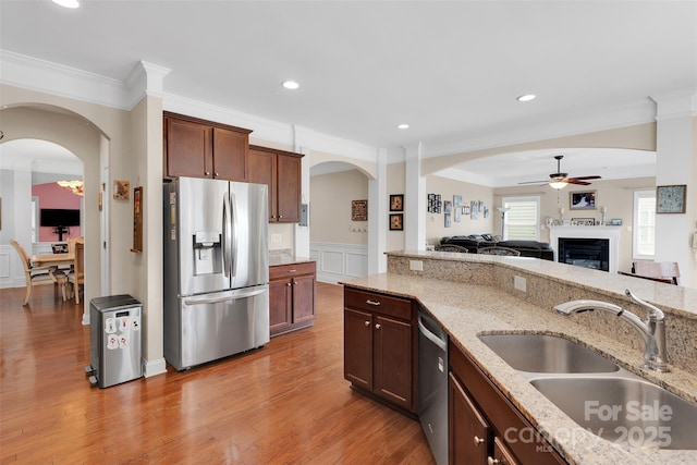 1636 Ridge Haven Rd, Waxhaw, NC 28173 - kitchen with appliances with stainless steel finishes, ceiling fan, ornamental molding, light stone countertops, and open floor plan