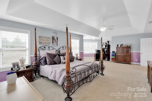 1636 Ridge Haven Rd, Waxhaw, NC 28173 - bedroom featuring a tray ceiling, light colored carpet, and a ceiling fan