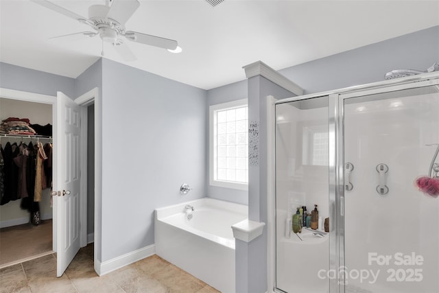 1636 Ridge Haven Rd, Waxhaw, NC 28173 - full bath with a stall shower, a walk in closet, a bath, tile patterned flooring, and a ceiling fan